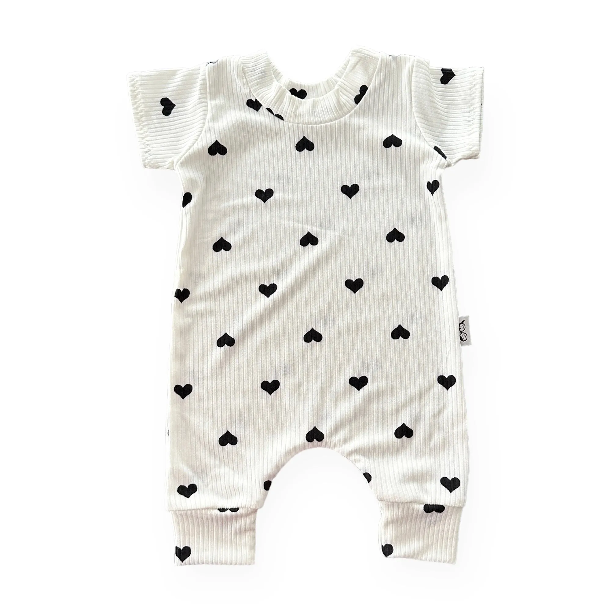 Flipped Black Hearts on White Ribbed Harem Romper